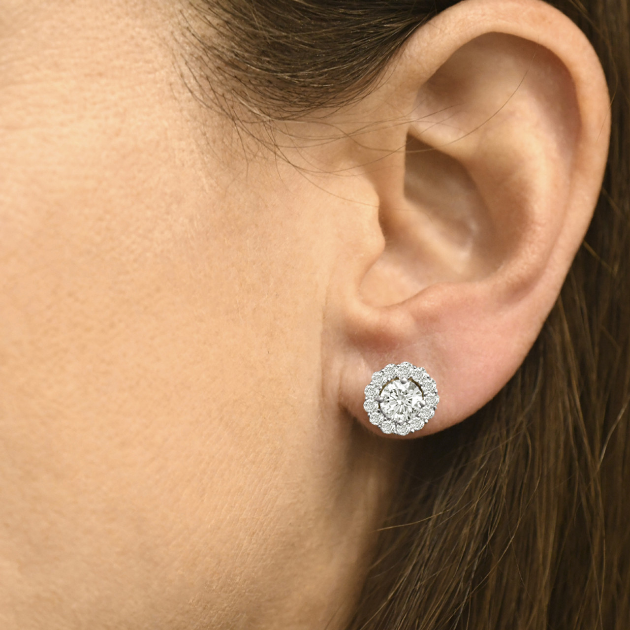 halo diamond earrings on ear