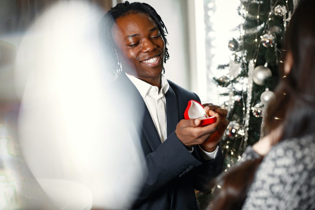 man proposing on Christmas morning