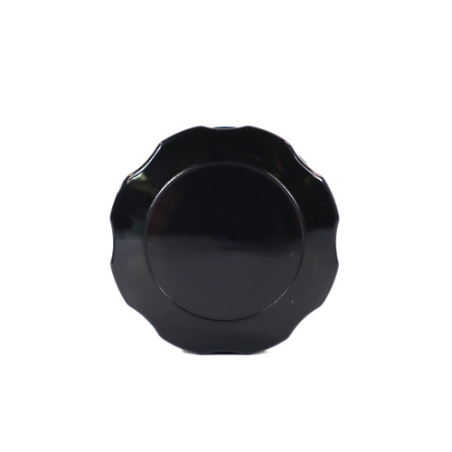Mahindra fuel tank cap 13603102000 shown as a round, knurled black cap with internal sealing gasket and vent, designed to twist onto the filler neck of Mahindra eMax20S, 5010 and 7010 tractor fuel tanks.