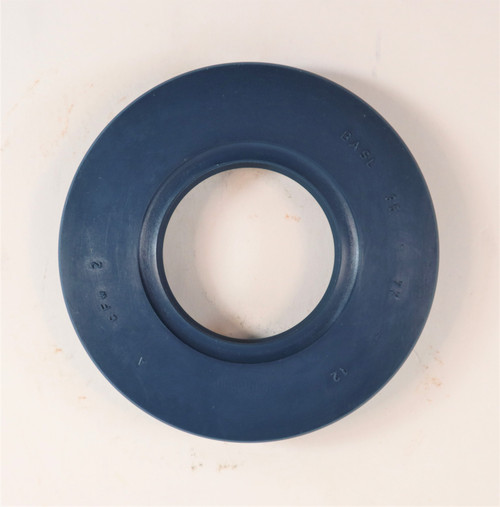 Mahindra rear PTO shaft seal 006505638D1 shown as a circular rubber‑coated metal oil seal that presses into the rear PTO housing and fits tightly around the splined PTO shaft on 35, 3500 and 3600 Series tractors to keep transmission/hydraulic oil from leaking out the back of the tractor.
