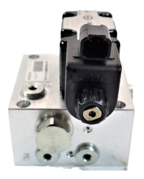 Mahindra PTO control valve assembly E007205306D91 shown as a cast hydraulic valve block with solenoid and ports that mounts on the transmission of 4035/5035, 3540/3550, 3640/3650, 6065/6075 and 7085/7095 tractors to route pressure oil for PTO clutch engagement.