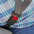 Regular black car seat belt extender in use with a plus sized man in a blue patterned shirt.