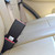 Black Rigid 3" Seat Belt Extender buckled into the back seat of a vehicle