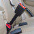 Black, rigid MAN TGE Van seven-inch extender buckled into the back seat of a vehicle and standing upright