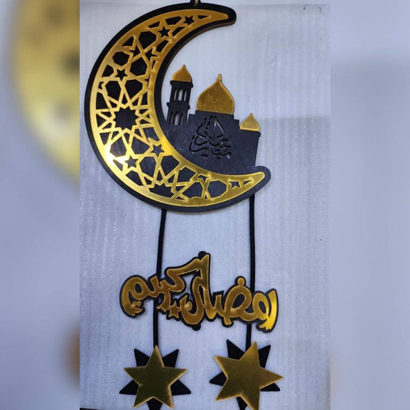 A wooden crescent and star hanging on a wall, adding a decorative touch to your Ramadan festivities.