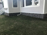 DIY Mobile Home Remodel with Stacked Stone Skirting