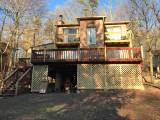 Stilt House Remodel with Stone Wall Siding