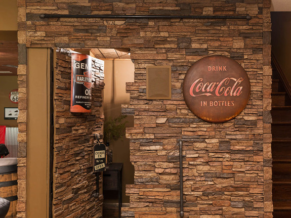Colorado Dry Stack Stone Wall Panels in sierra brown used on to create a hidden door that blends with the wall.