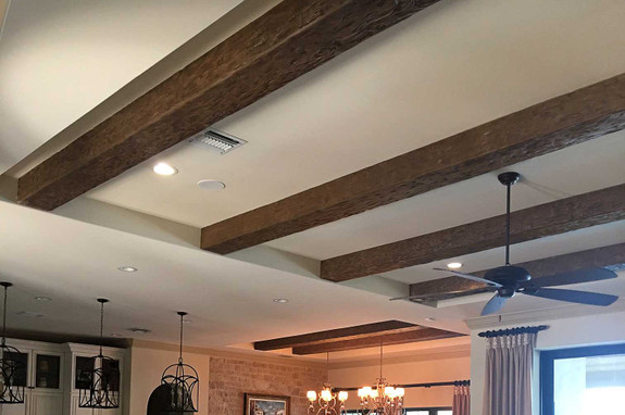 This living room ceiling decorated with our Tuscany Faux Wood beams in the caramel color.
