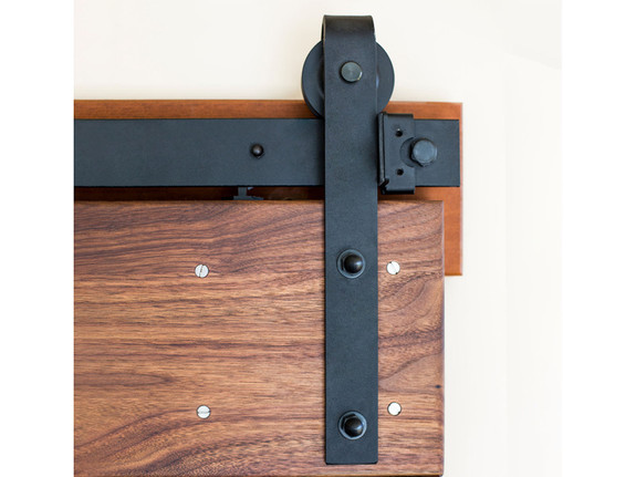 Classic Barn Door hanger in black shown with soft close mechanism, matching flat track, adjustable end stop and header board-thumb