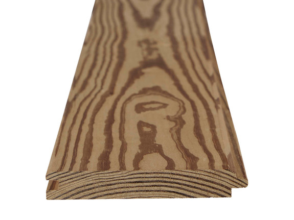 Thermally treated pine tongue and groove plank showing the grain on the face of the plank as well as the grain on the cut end. Shiplap side is facing up.-thumb