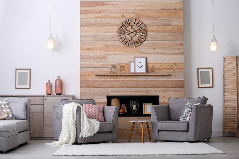 Faux wood paneling around a fireplace adds a cozy feel to a modern space.