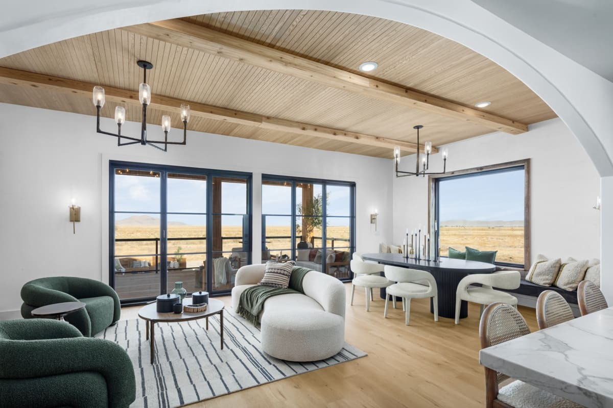 Customer-finished Wire Brushed Wood Beams installed on a transitional living and dining area ceiling.