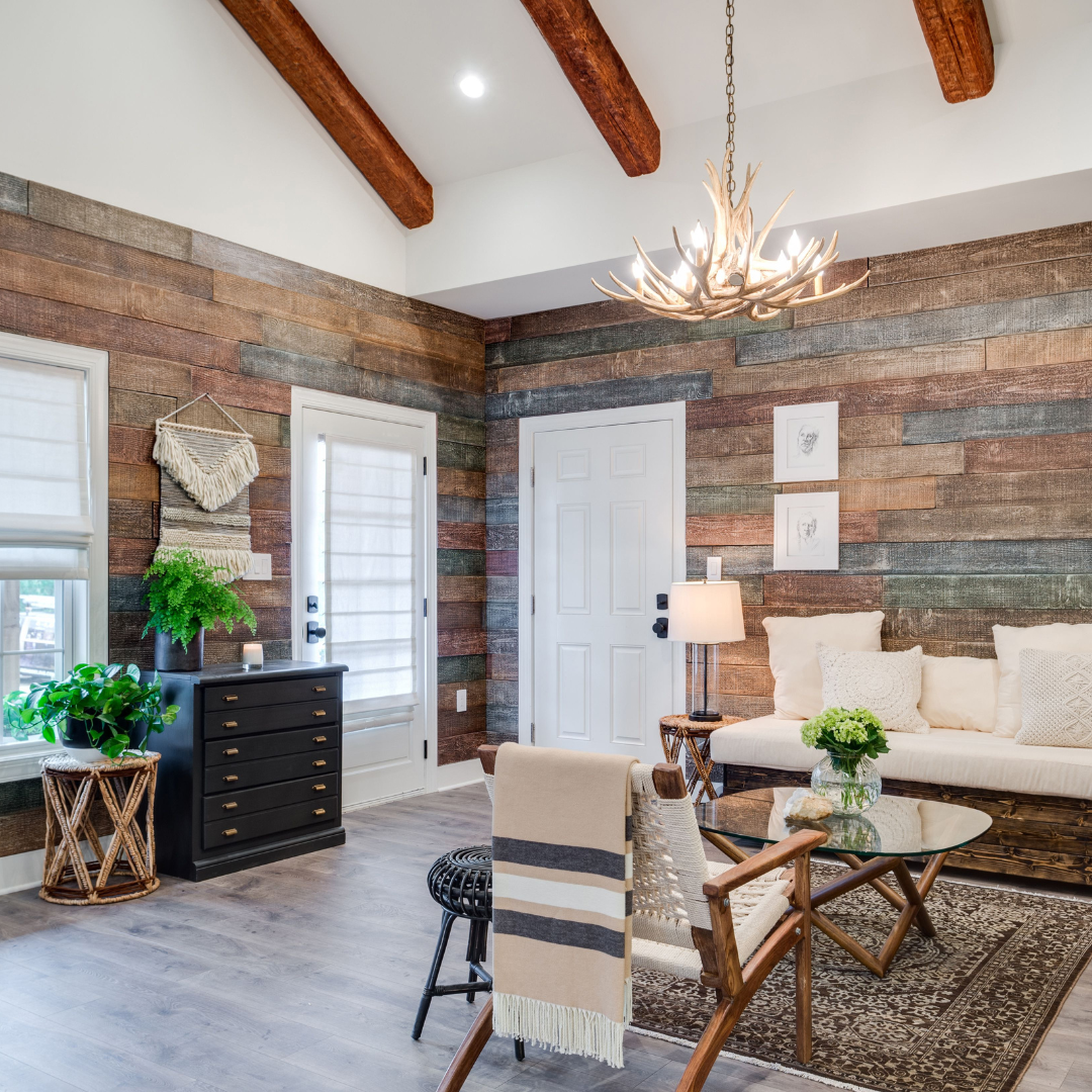 Framhouse styled living roomwith faux wood beams and faux wood wall paneling on all of the walls