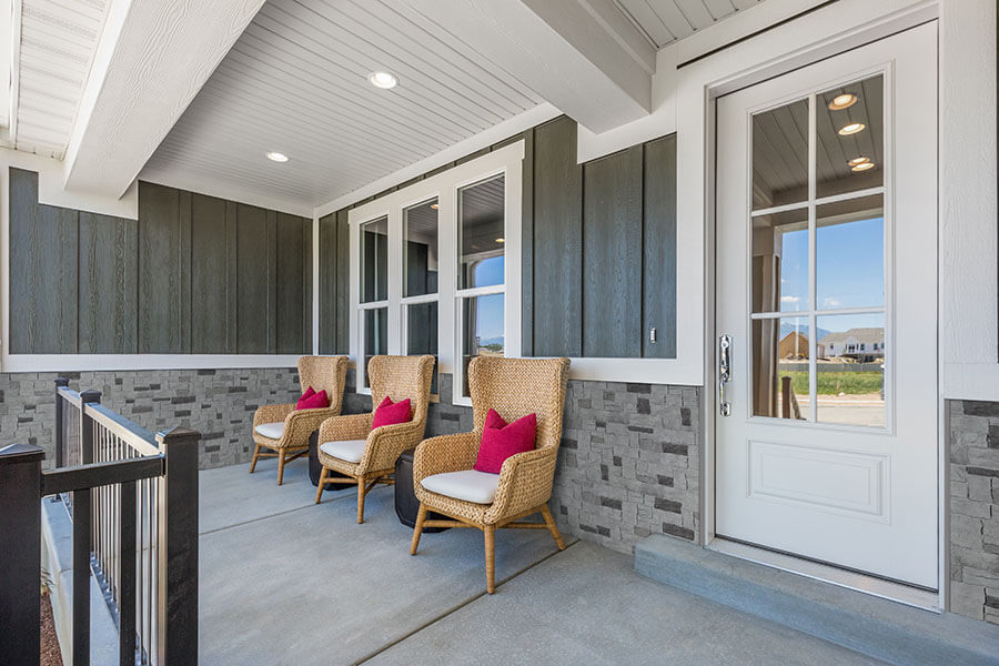 Novi Cobblestone in Castle faux panels enrich a front porch.