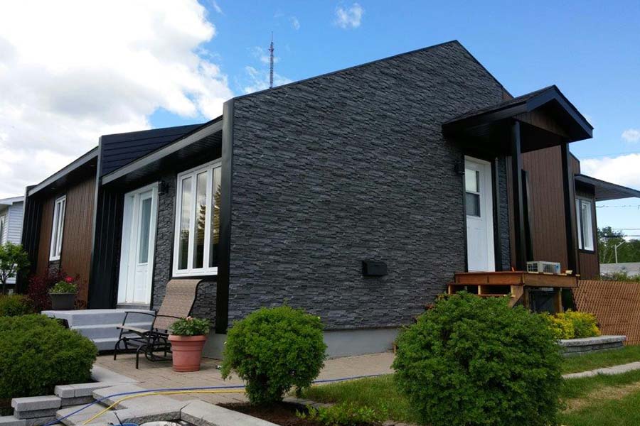 Novik dry stack faux stone siding panels in anthracite