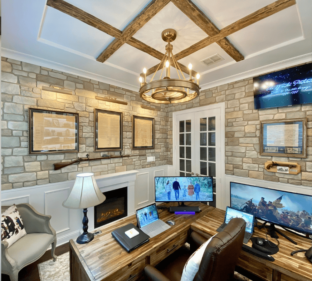 Home office with faux wood beams and faux stone wall panels