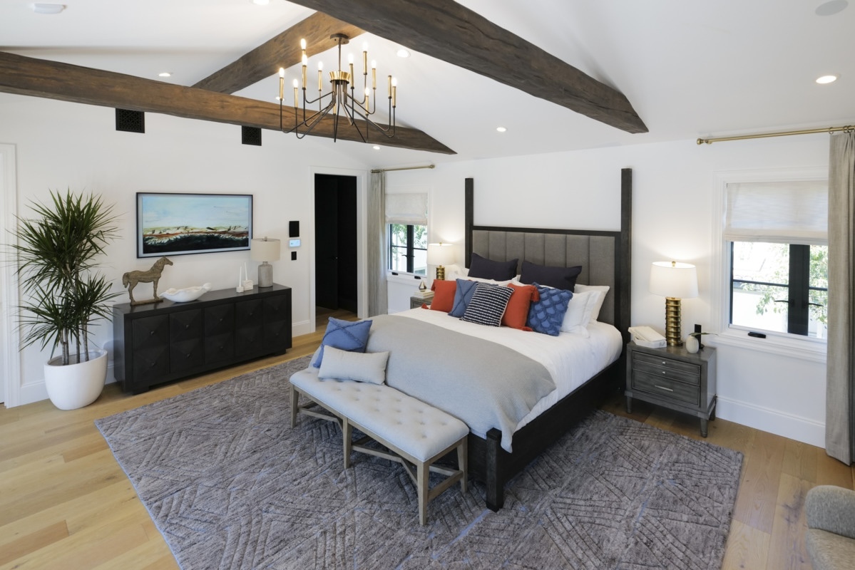 Timber Faux Wood Beams in Rich Walnut installed on a modern style bedroom ceiling.