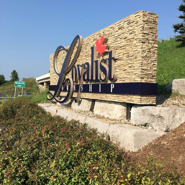 Exterior commercial sign using faux stone wall panels from Barron Designs