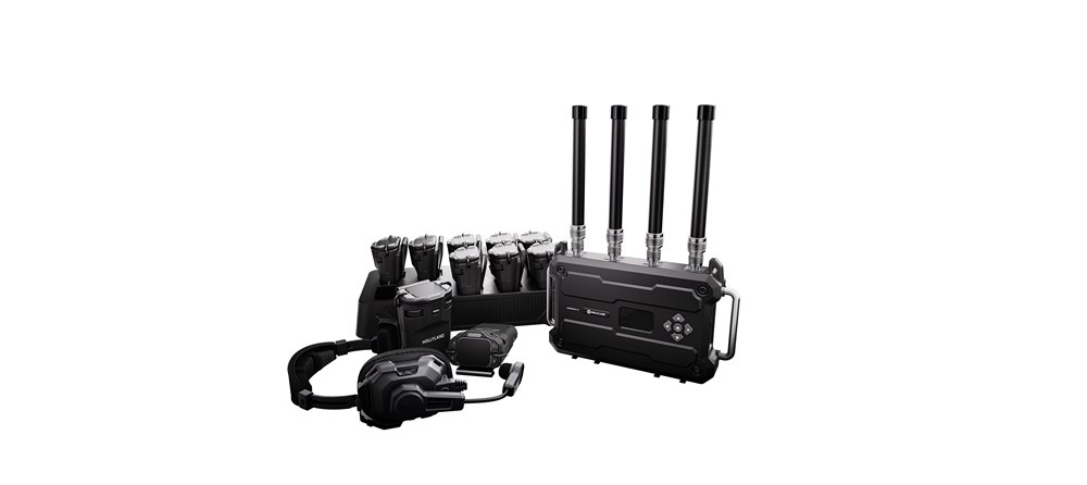 A Solidcom H1 base station with its antennas, shown with two beltpacks.