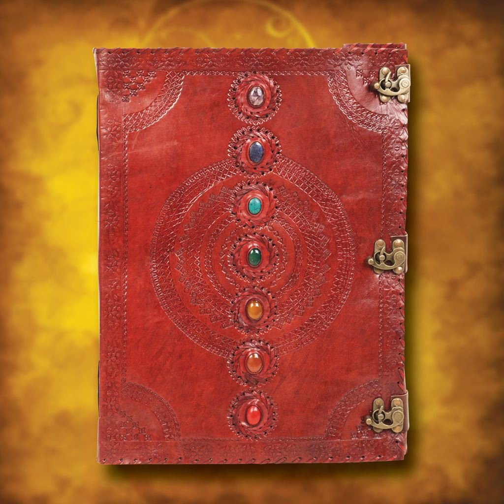 oversized journal is embossed brown leather, front is adorned with seven chakra stones and three antiqued brass metal latches