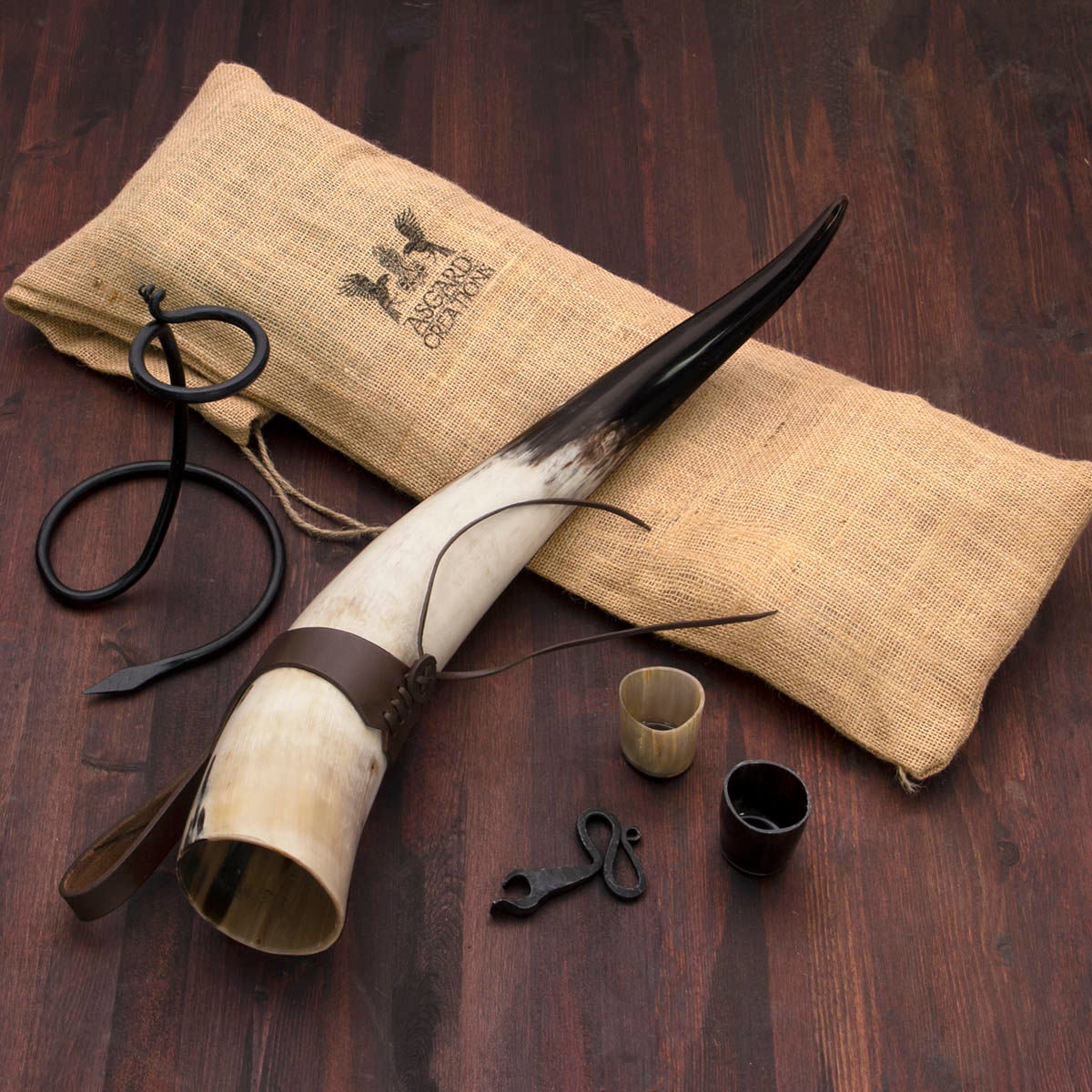 Thor's Horn Drinking horn Set with iron stand, leather frog, 2 horn shot glasses and iron bottle opener, all in a jute bag
