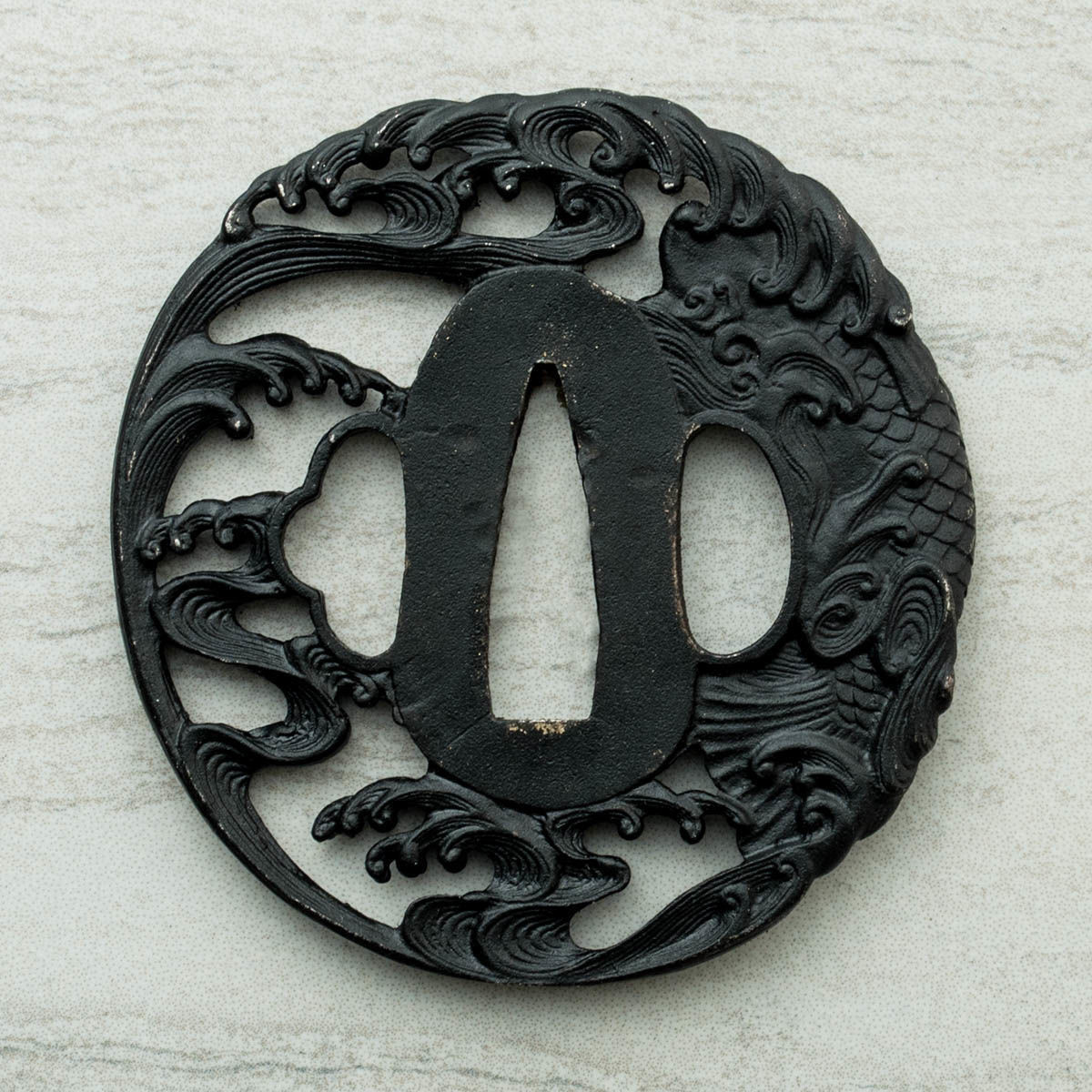 Black iron tsuba on Koi Wakizashi from Paul Chen / Hanweo  depicts a finely rendered Koi, with front and back detail