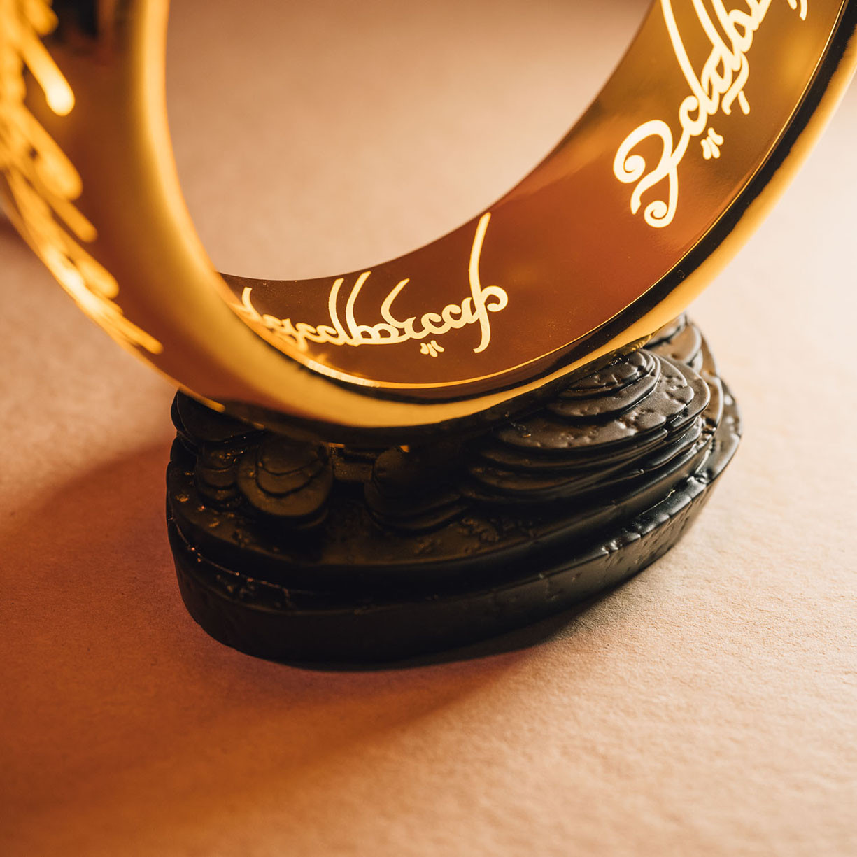 large LOTR One Ring Lamp has a warm glow, the sturdy stand has an on/off button and allows display on tables and shelves