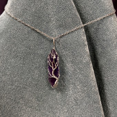 Amethyst crystal wrapped with wire in a tree Tree of Life design, hangs from 19" silver chain with 1/4" bale