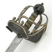 Cromwell Sword has blackened guard decorated in a gold foliage pattern, wire-wound sharkskin grip and 1566 carbon steel blade