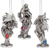 set of 3 silver dragon ornaments, each has a faceted faux gemstone that sparkles in the light