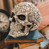 Skull's Soul Spirit Keepsake Box is a decorative skull featuring tortured souls, storage for trinkets inside