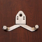 sword hanger for edged weapons is polished steel with adjustable bracket, hanger almost disappears once mounted on the wall