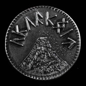 Solid black iron Eye of Sauron LOTR coin reverse side has text "ORODRUIN" surrounding nefarious mountain Orodruin 