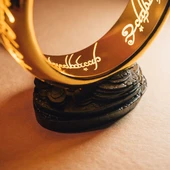 large LOTR One Ring Lamp has a warm glow, the sturdy stand has an on/off button and allows display on tables and shelves