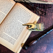 Flourish and Blotts Vintage Page Holder has pointing singer to use as a bookmark