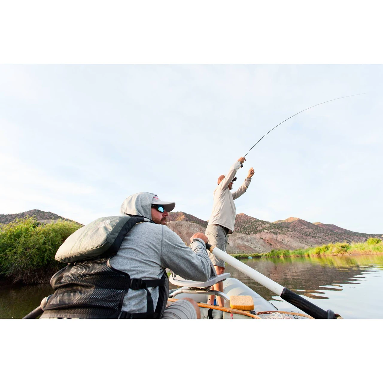 Fighting a fish from a drift boat with a Scott Session fly rod