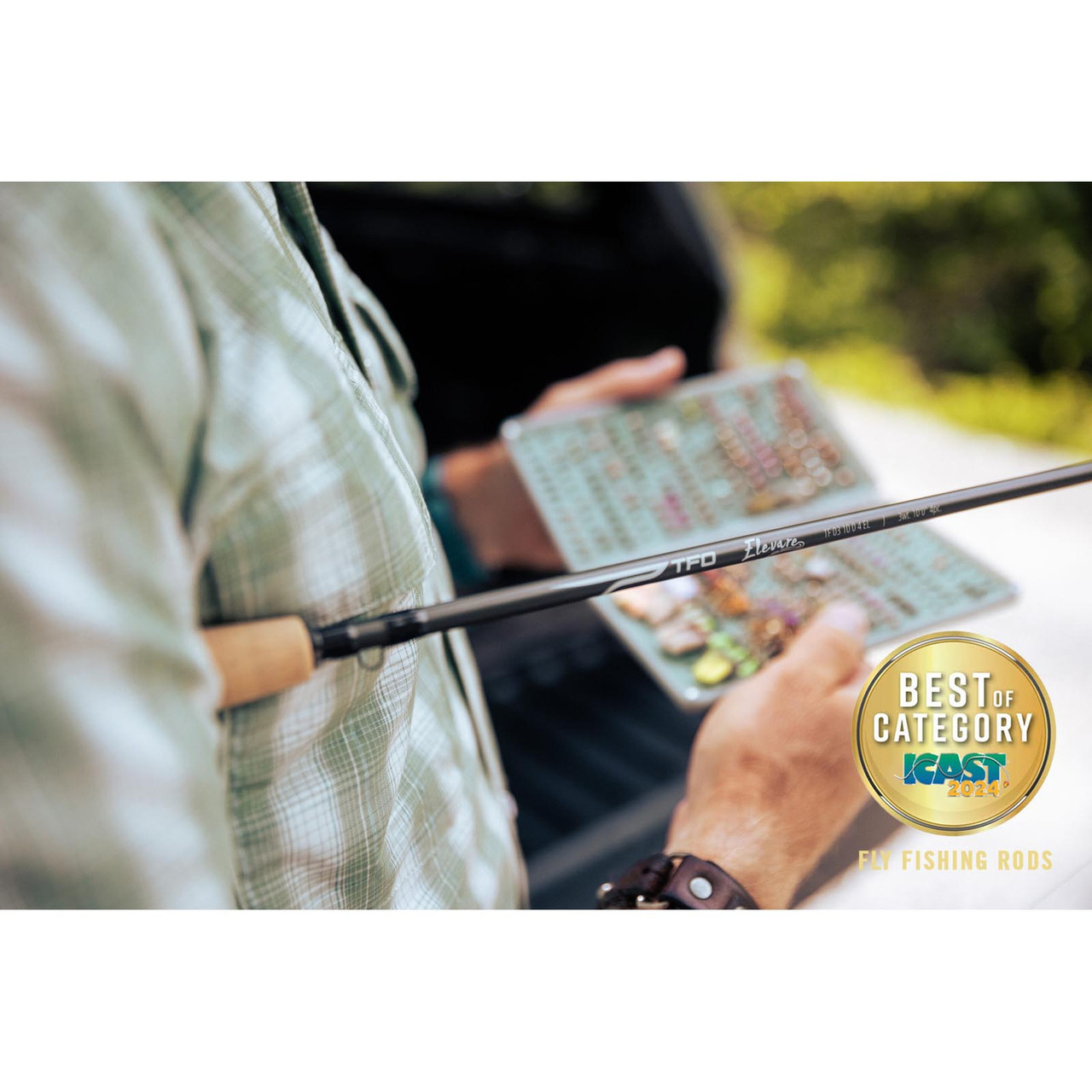 TFO Elevare rod blank beside an angler's open nymph fly box
