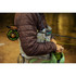 Angler carrying a rigged TFO Solution fly rod beside a river