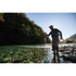 Angler fishing a Scott Centric fly rod on a clear river