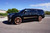 Side view of 2015 Escalade on 26" Forgiato w/ Custom rose gold Lowered on McGaughys 2/3 drop kit