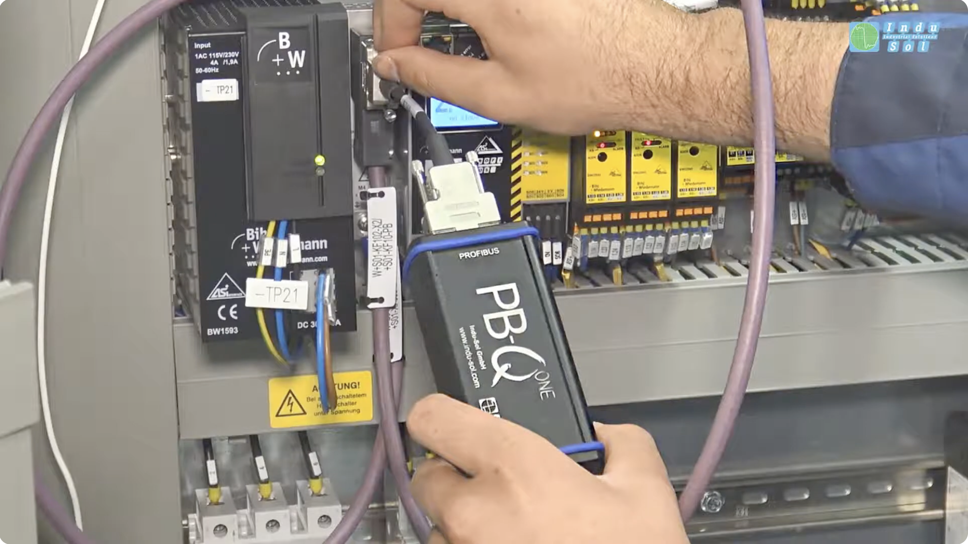 PB-Q ONE PROFIBUS tester connected to an industrial control cabinet