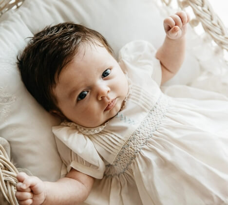 newborn baby girl with brown hair