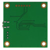 A backside view of a green circuit board with mounting holes in each corner.