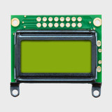Front view of an unlit 8x2 character LCD with a blank STN+ yellow-green screen.