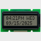 Front view of a 12x2 character LCD with an unlit STN+ gray screen showing time and date information in dark text.