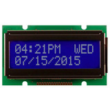 Front view of a 12x2 character LCD with an unlit STN- dark blue screen showing time and date information in white text.