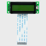 Front view of 16x2 character LCD with an installed FFC ribbon cable and an unlit STN+ yellow-green screen.