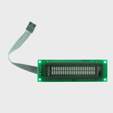 A 20x2 character VFD on a green circuit board with the grid of inactive gray 5x8 dot matrix characters fully visible.