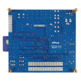 The back of a blue circuit board with the top of an SD card showing over the left edge.